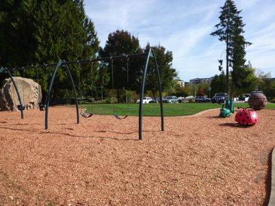 Playground is close to the parking lot